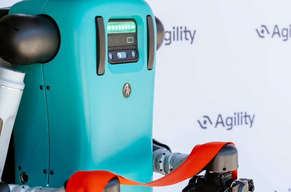 robot holding red ribbon