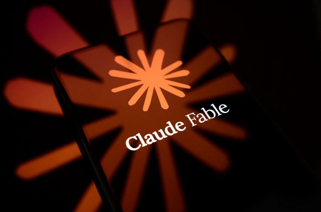 The Claude Fable logo is displayed on the screen of a smartphone placed on a reflective surface onto which the company's icon is projected.