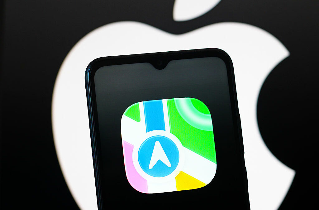 In this photo illustration, the Apple Maps logo is seen displayed on a smartphone screen.