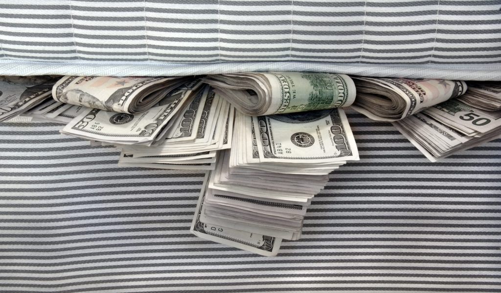 cash stuffed in a mattress