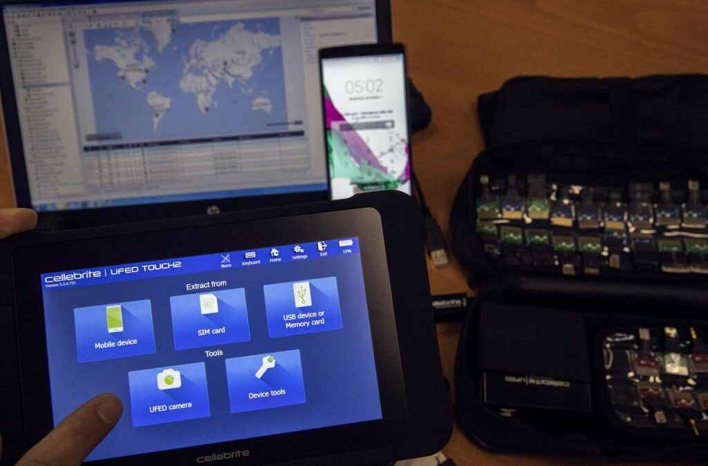 An engineer shows devices and explains the technology developed by the Israeli firm Cellebrite.