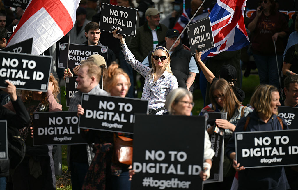 Demonstrators protest against the Labour Government's plans to introduce a Digital ID, outside of the Labour Party's conference in Liverpool, north-west England, on September 28, 2025. The government, which hopes to introduce the ID by the end of the current parliament in 2029, said the drive would also make it simpler to apply for services like driving licences, childcare and welfare, while streamlining access to tax records. (Photo by Oli SCARFF / AFP) (Photo by OLI SCARFF/AFP via Getty Images)