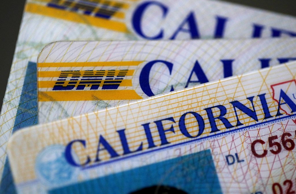 In this photo illustration, the California Department of Motor Vehicles (DMV) logo appears on a California driver license.