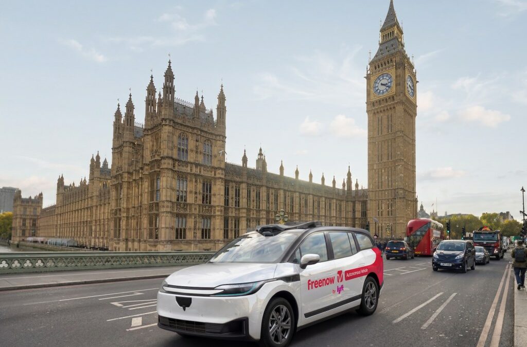 Baidu and Lyft robotaxi on road in front of Big Ben in London.