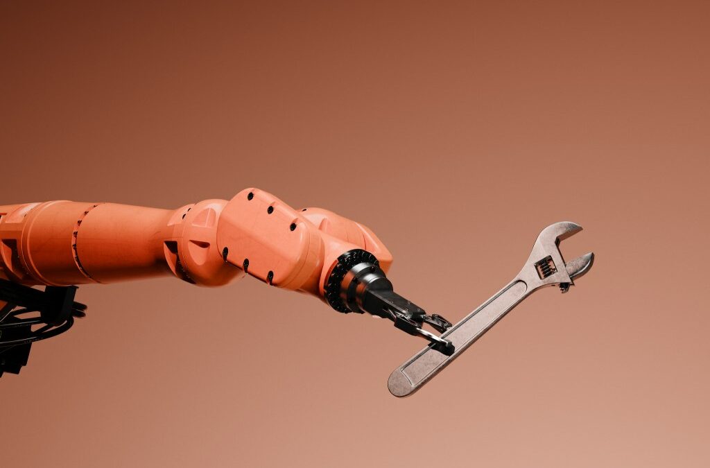 Conceptual image of a robotic arm holding a wrench.