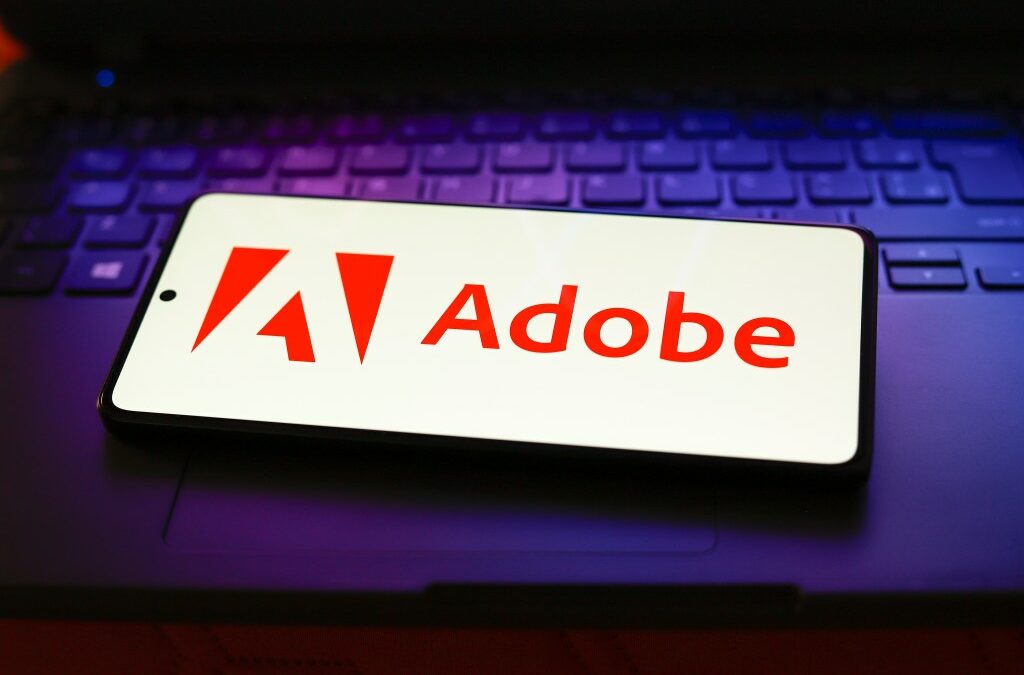 The Adobe Inc. logo displayed on a smartphone screen.