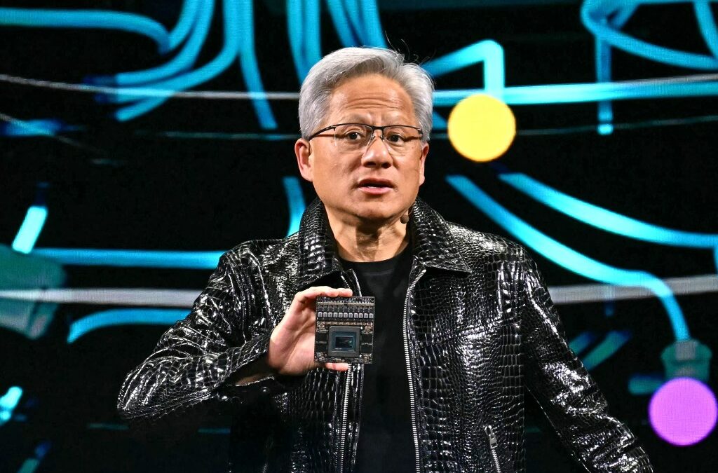 Jensen Huang holds up chip at CES 2025