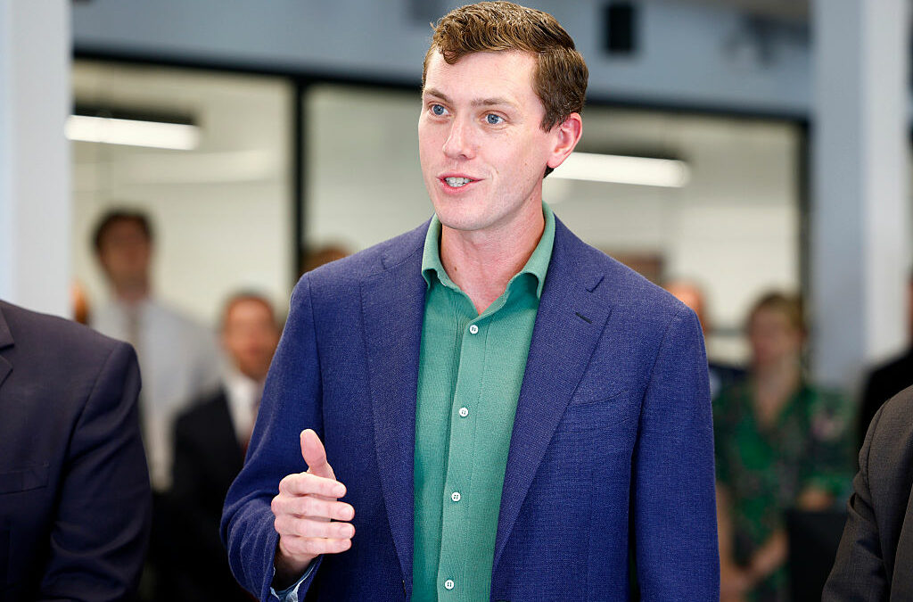 Garrett Langley, CEO and co-founder of Flock Safety, speaks during a ribbon cutting for the Seaport District headquarters on July 22, 2025.