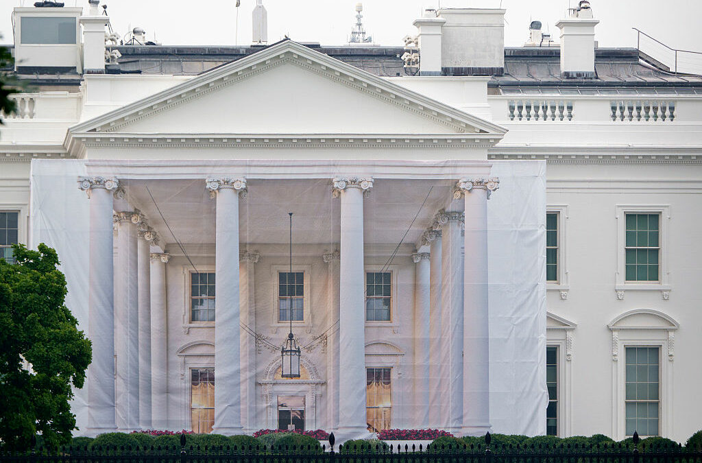 A protective tarp with a photo on it covers the scaffolding and the columns on the North Portico of the White House on July 18, 2026 in Washington, DC..