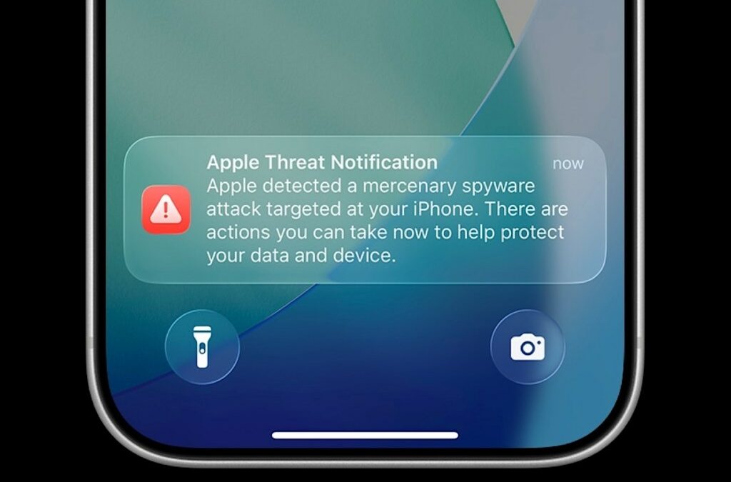 an Apple threat notification on an iPhone lock screen.