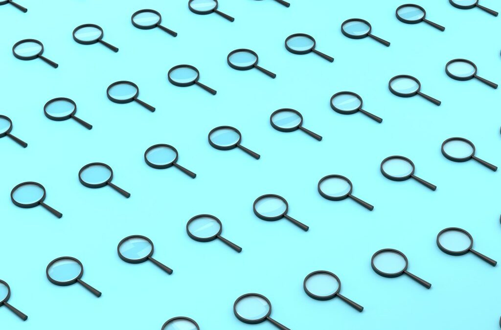 Repeated Magnifying Glass On Blue Background