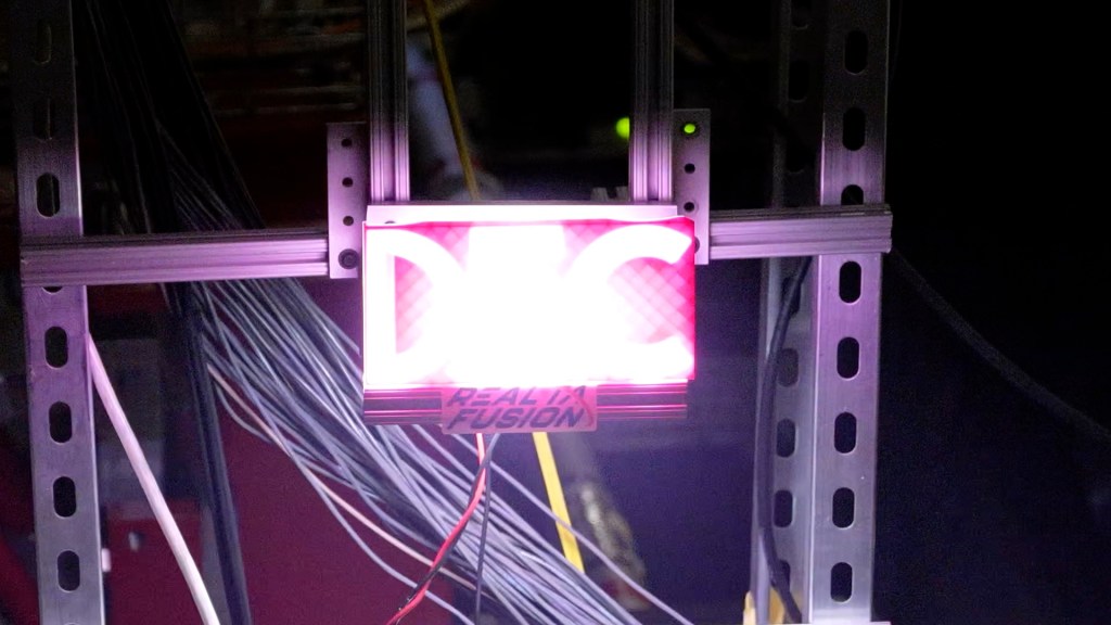 A sign that says DEC is lit with purple backlighting.