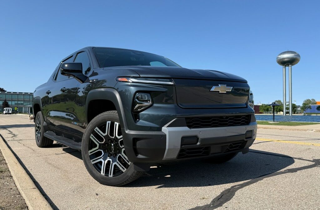 A Silverado EV stands with its front wheels turned.