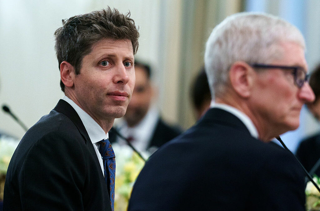 Sam Altman, chief executive officer of OpenAI Inc., left, and Tim Cook, chief executive officer of Apple Inc.