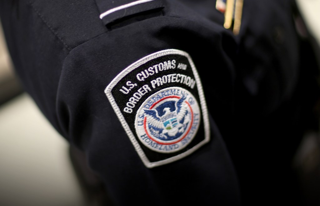 MIAMI, FL - MARCH 04: A U.S. Customs and Border Protection officer's patch is seen as they unveil a new mobile app for international travelers arriving at Miami International Airport on March 4, 2015 in Miami, Florida. Miami-Dade Aviation Department and U.S. Customs and Border Protection (CBP) unveiled a new mobile app for expedited passport and customs screening. The app for iOS and Android devices allows U.S. citizens and some Canadian citizens to enter and submit their passport and customs declaration information using their smartphone or tablet and to help avoid the long waits in the exit lanes. (Photo by Joe Raedle/Getty Images)