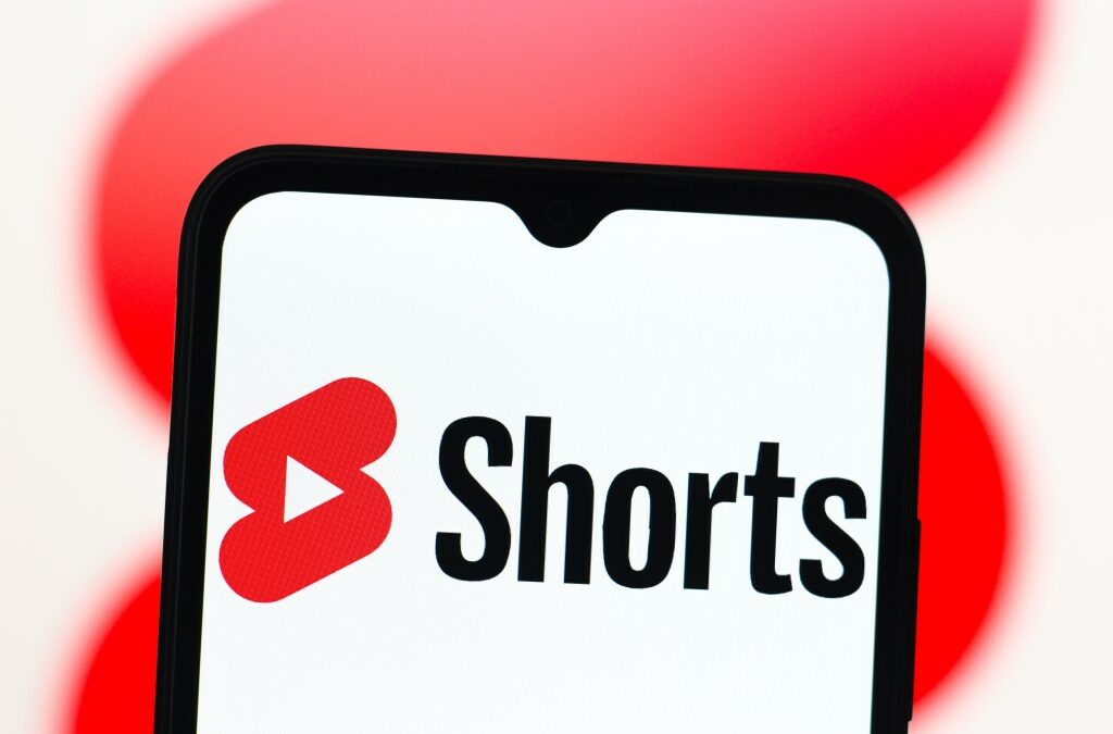 In this photo illustration, the YouTube Shorts logo is seen displayed on a smartphone screen.